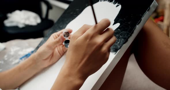 Hands Close Up of Young Artist Woman Painting Portrait of His Daughter on Canvas