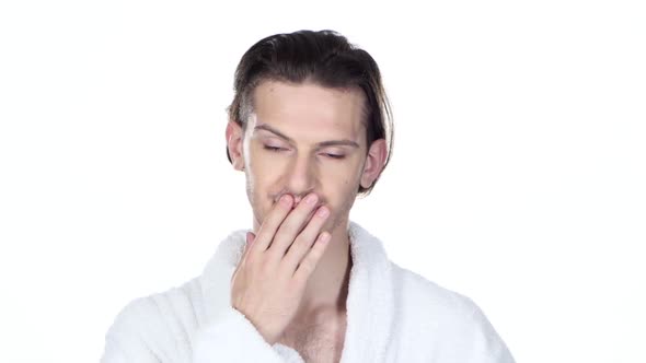 Man Yawning Mouth Covering His Hand, Drinking Coffee. White Background