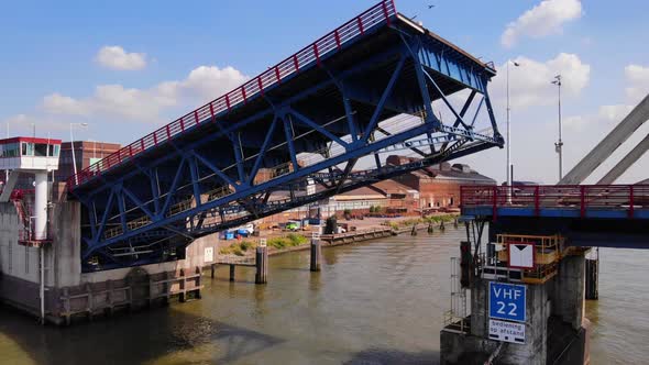 Closing The Steel Single-leaf Bascule Bridge Over North River On A Sunny Summer Day In Alblasserdam,