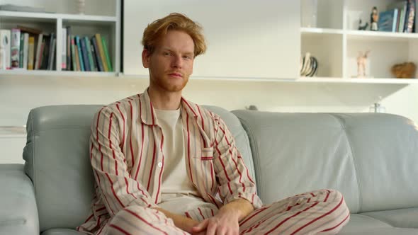 Pensive Freelancer Resting Home on Couch Closeup