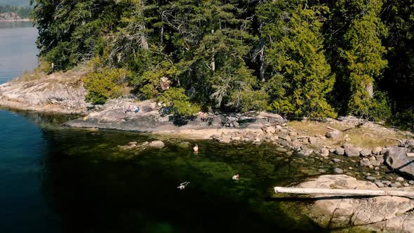 People On the Rocky Shore Of Sunshine Coast Near Egmont In British Colombia, Canada. Aerial Shot