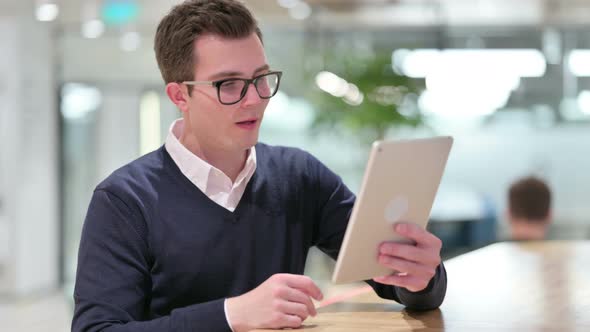 Professional Young Businessman Doing Video Call on Tablet 