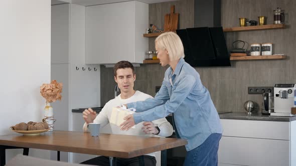 Young Beautiful Couple at Home in the Kitchen