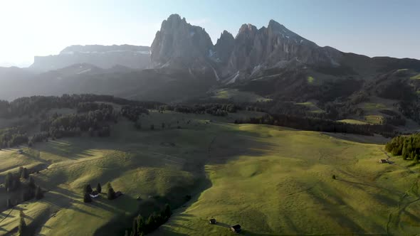 Drone Pointing Down on Meadows and Huts at Alpe di Suisi, Dolomites, Italy