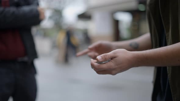 Close Up Shot of Man Showing Cards Trick in the City Street