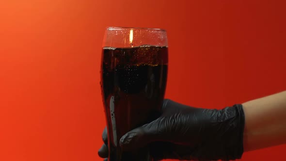 Person Serving Carbonated Drink With Straw Inside, Unhealthy Sweet Beverage