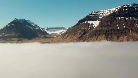 Drone Flight Over Clouds Towards Mountains