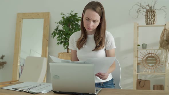 Stressed Hysterical Woman Who is Tired of Work Throws a Paper Document in the Air Who Feels Stressed