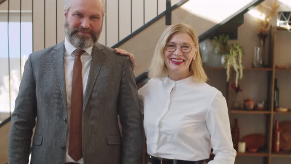 Portrait of Cheerful Senior Male and female Colleagues