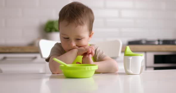 Cute Baby Boy Does Not Want to Eat Waves His Head