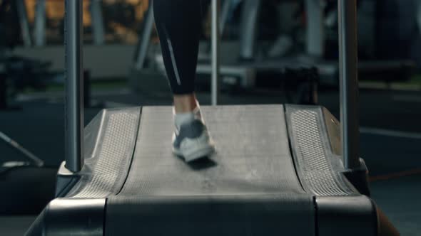 Male athlete athlete is doing cardio training on a treadmill, bodybuilder is running