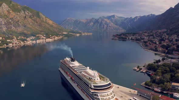 Cruise Ship in the Port of Kotor at Mountains Background Montenegro