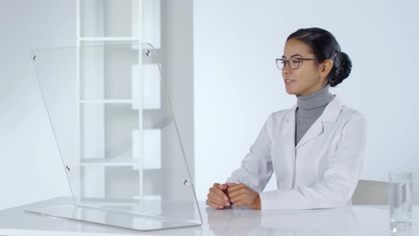 Female Doctor Talking with Patient Online