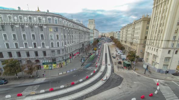 Construction Site of Avenue with Asphalt Paver Roller and Truck Aerial Timelapse