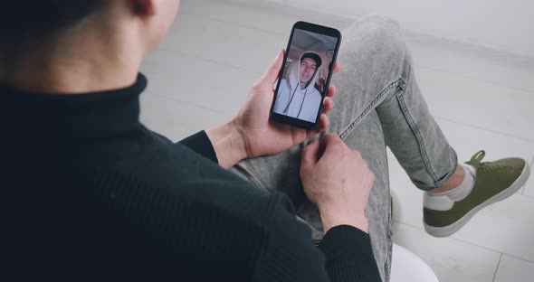 Closeup Man Watching Internet Video Blog Using Smartphone