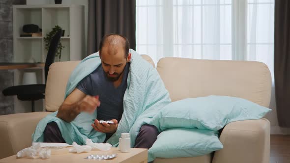 Sad and Sick Man on Sofa