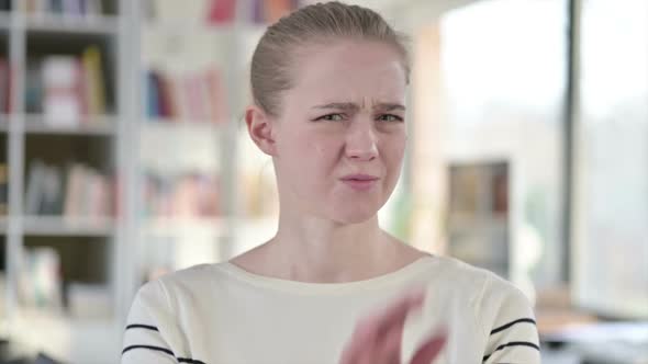 Portrait of Young Woman Arm Gesture No Sign