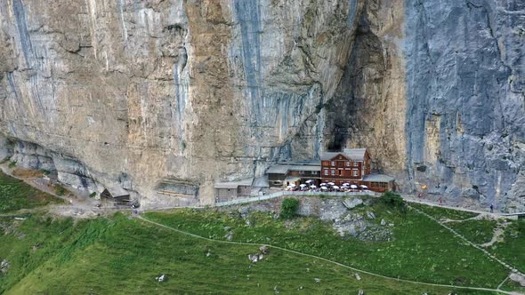 Flying Around a Restaurant Under a Cliff on Mountain Ebenalp in Switzerland