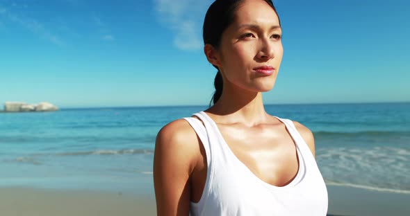 Beautiful woman standing on beach