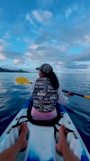 Mauritius Vacation Couple Man and Woman in Kayak in a Bleu Ocean in Mauritus