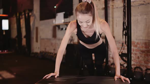 Athletic Woman Exercising At Health Studio