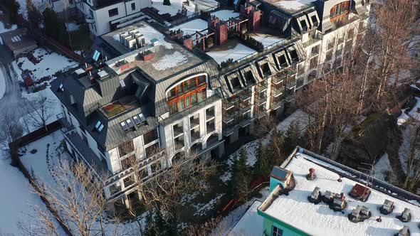 Nosalowy Park Hotel at Zakopane in winter. Poland. Aerial backward tilt-up