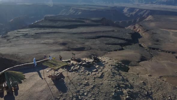 Drone footage of the watch point of the canyon on top of the cliff, people