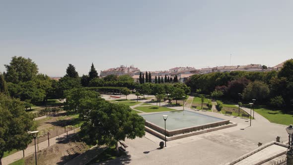 Aerial view over Public Garden with pond surrounded by vegetation - Castelo Branco