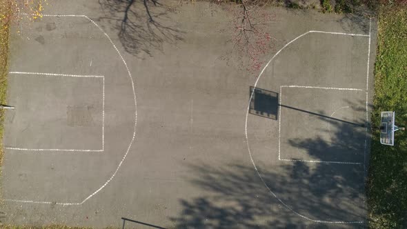 Empty asphalt basketball court in the park. Top down view 63