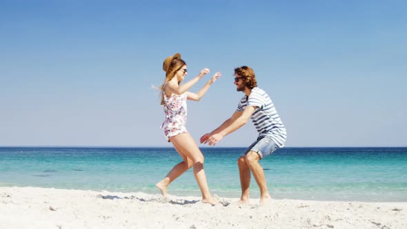 Couple enjoying together at beach