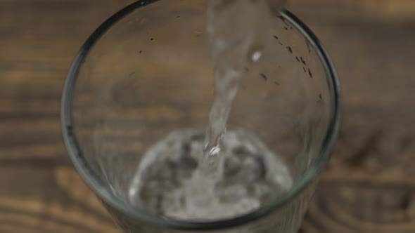 Close up pouring purified fresh drink water