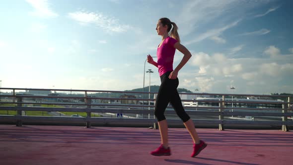 Sporty Girl Having a Morning Jog in the City