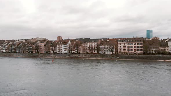 Rhine river against riverside Basel cityscape,  Switzerland. Charming aerial scenic view