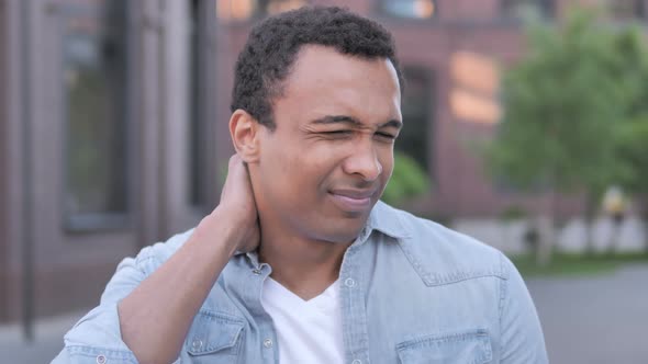 Tired African Man with Neck Pain