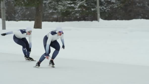 Female Speed Skater Finishing First