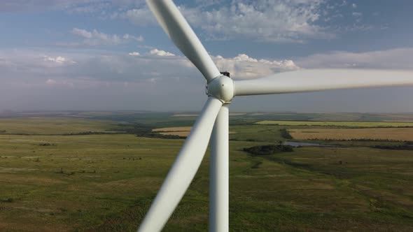 Wind Turbines in a Field Against the Sky