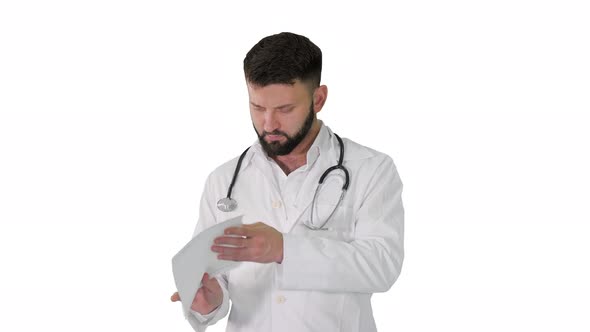 Caucasian Serious Doctor Walking and Explaining Cardiogram on White Background.