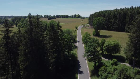 Road in nature reserve Eifel in Germany near Kalterherberg, hills and forest