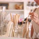 Young Mixed Race Woman Choosing Bamboo Eco Friendly Biodegradable Toothbrush in Zero Waste Shop. No - VideoHive Item for Sale