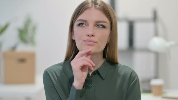 Portrait of Pensive Young Woman Thinking