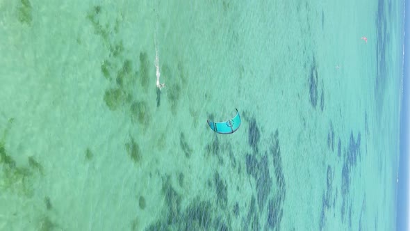 Zanzibar Tanzania  Vertical Video Kitesurfing Near the Shore of Ocean Slow Motion