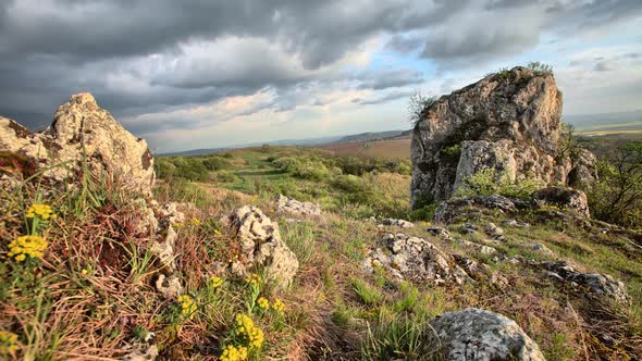 Sunny time lapse with cloudy sky and rocks