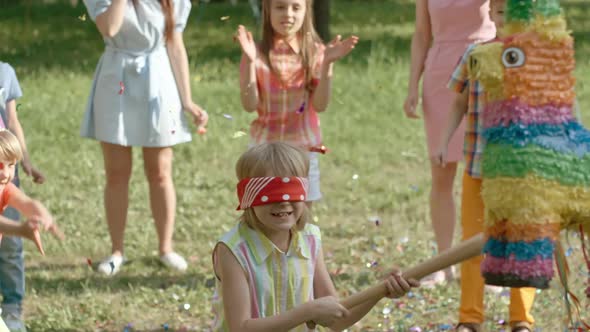 Kid Enjoying Hitting Pinata