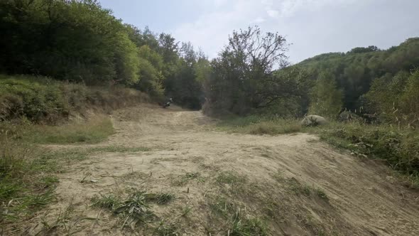 Rider On Sports Motorcycle Descends Hill