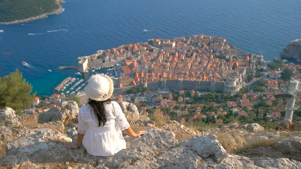 Woman Tourist Looking at City of Dubrovnik Croatia