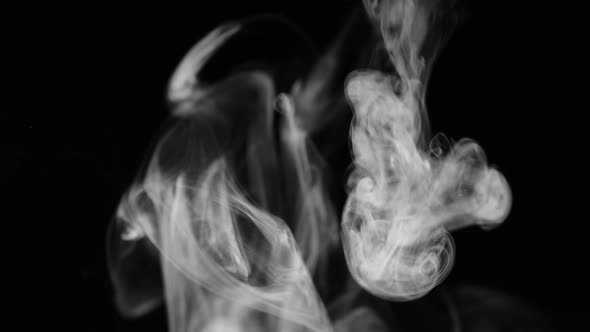 White Smoke on Black Background in Slow Motion