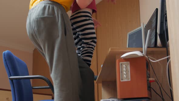 Boy With Father At The Computer alt