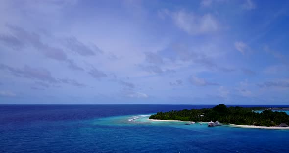 Natural overhead travel shot of a white sand paradise beach and aqua blue ocean background in colorf