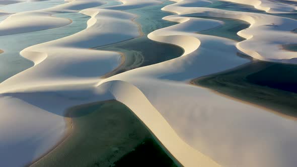 Scenic waving sand dunes and rainwater lakes at Lencois Maranhenses National Park