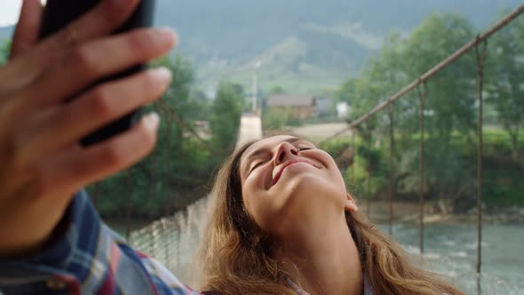 Beautiful Woman Taking Photo Selfie Using Phone at Mountains Nature Landscape